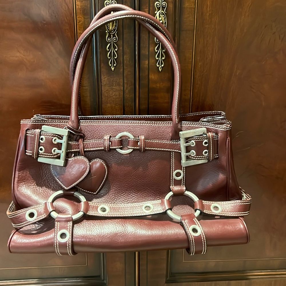 Beautiful burgundy handbag with silver detail, and buckles